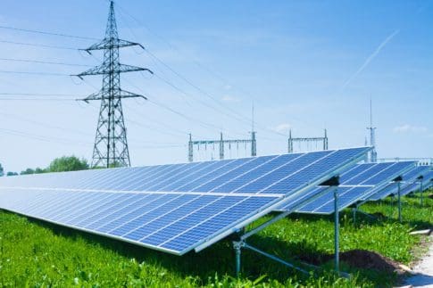 Solar panel against high voltage towers